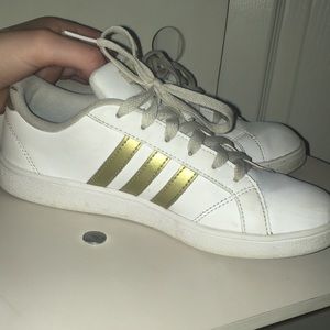 Girls gold and white adidas shoes!
